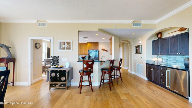 kitchen with visible vents, appliances with stainless steel finishes, and a sink