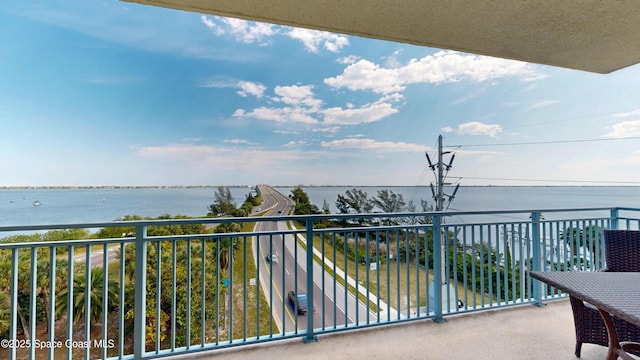 balcony featuring a water view