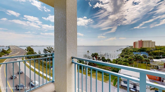 balcony featuring a water view