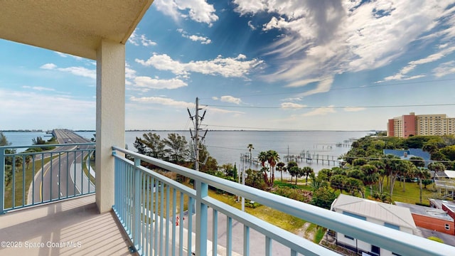 balcony featuring a water view