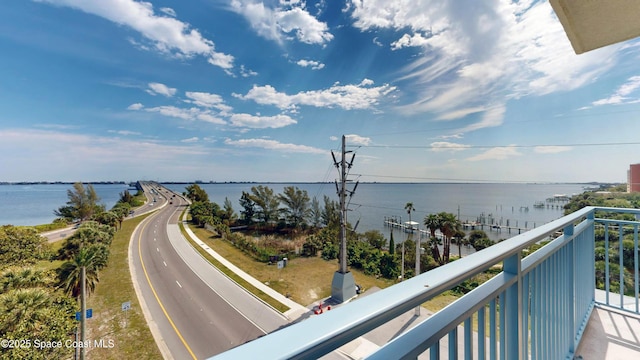 balcony featuring a water view