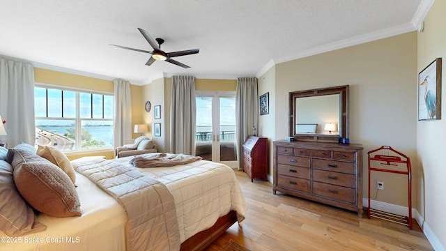 bedroom featuring access to exterior, crown molding, light wood-type flooring, and baseboards