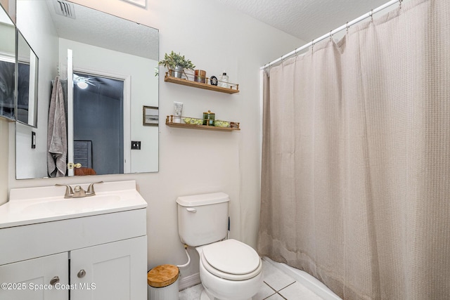 full bathroom with tile patterned flooring, toilet, visible vents, and a textured ceiling