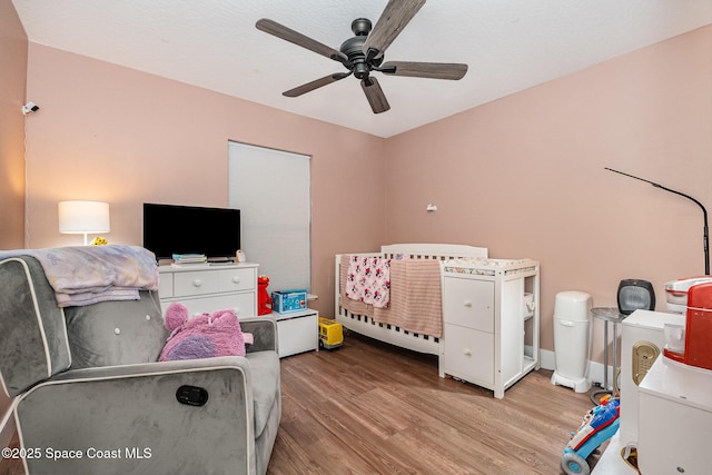 bedroom featuring ceiling fan and wood finished floors