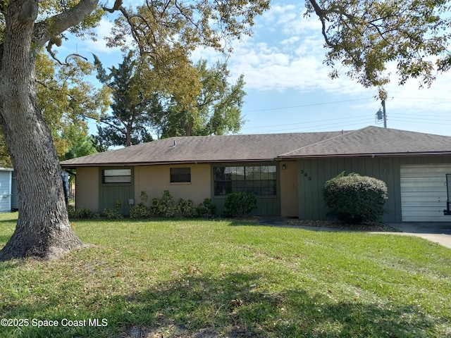 single story home featuring a garage, concrete driveway, and a front lawn