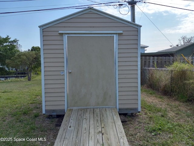 view of shed with fence