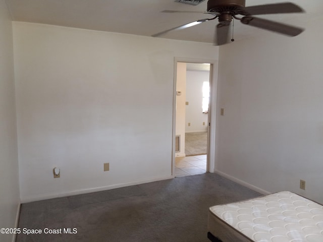 unfurnished bedroom featuring visible vents, ceiling fan, baseboards, and carpet floors