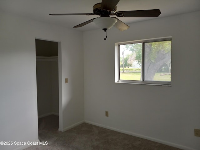 unfurnished room featuring baseboards and carpet floors