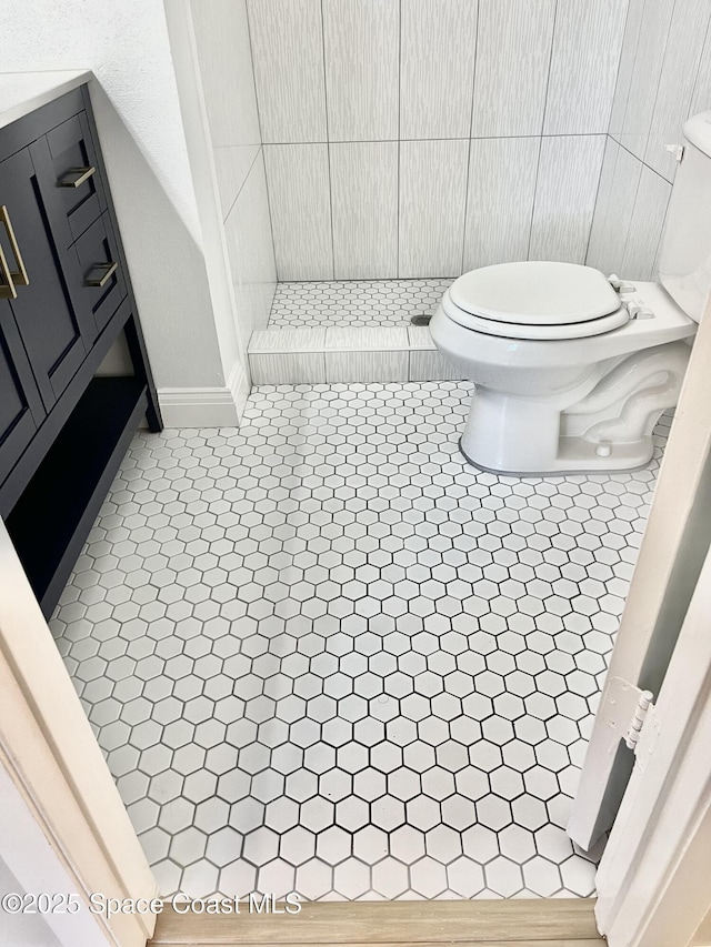 bathroom with tile patterned floors and toilet