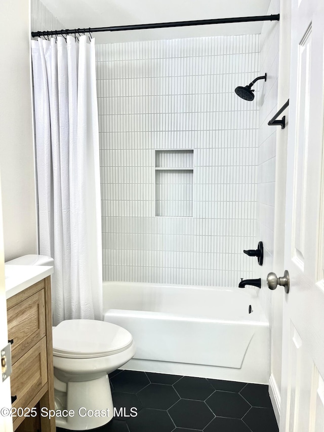 full bathroom with shower / bathtub combination with curtain, toilet, vanity, and tile patterned flooring