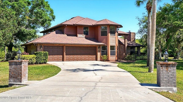 view of front of property featuring roof with shingles, concrete driveway, a front yard, brick siding, and a chimney