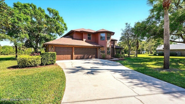 view of front of house with a garage, brick siding, concrete driveway, and a front yard