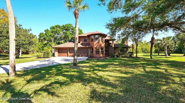 view of front facade with a front lawn, an attached garage, and driveway