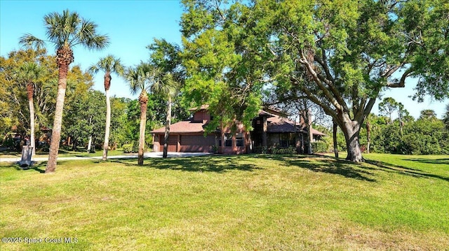 view of yard with an attached garage