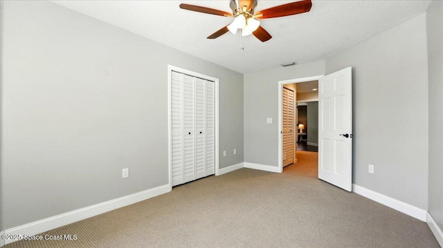 unfurnished bedroom featuring visible vents, baseboards, and carpet