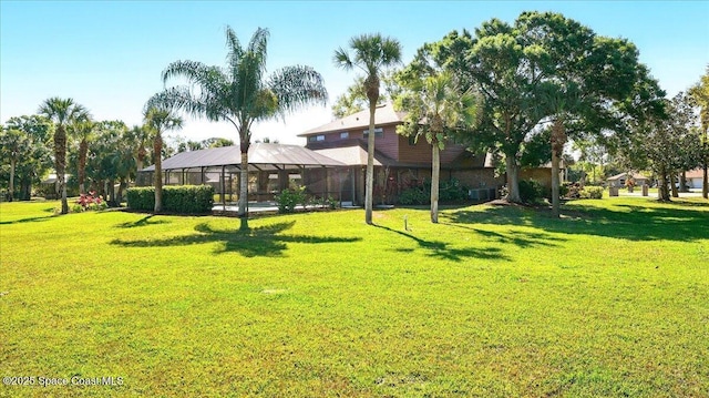 view of yard featuring a lanai