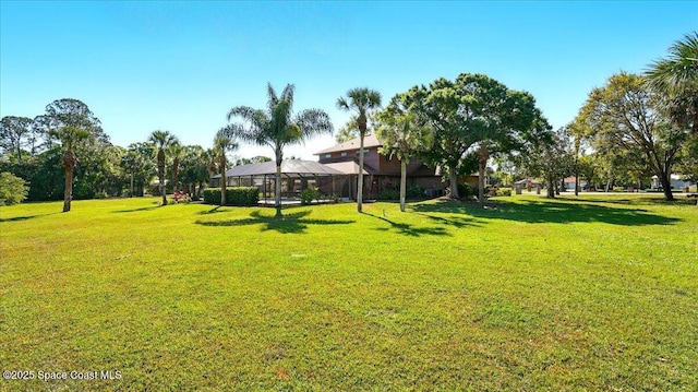 view of yard with glass enclosure