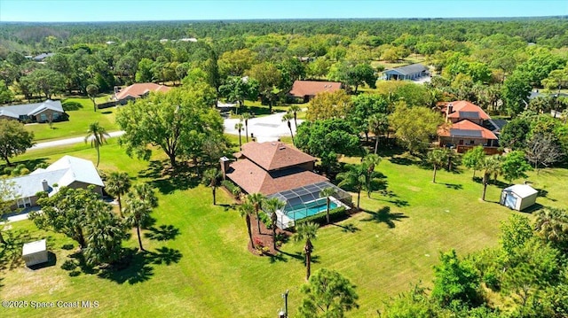 birds eye view of property featuring a residential view and a view of trees