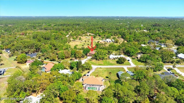 bird's eye view featuring a forest view