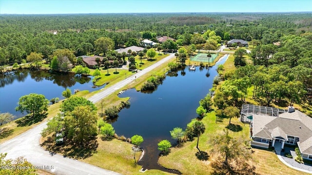 bird's eye view featuring a view of trees and a water view