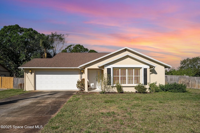 ranch-style house featuring a front lawn, fence, and stucco siding