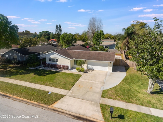 ranch-style house featuring a garage, concrete driveway, a front lawn, and fence