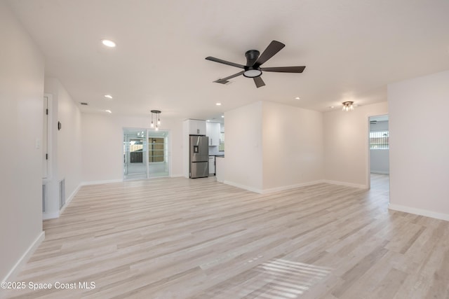 unfurnished living room with visible vents, recessed lighting, light wood finished floors, baseboards, and ceiling fan