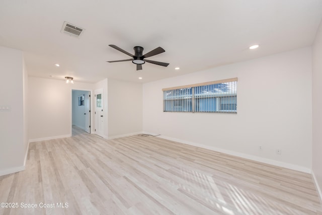 empty room featuring visible vents, recessed lighting, light wood finished floors, baseboards, and ceiling fan