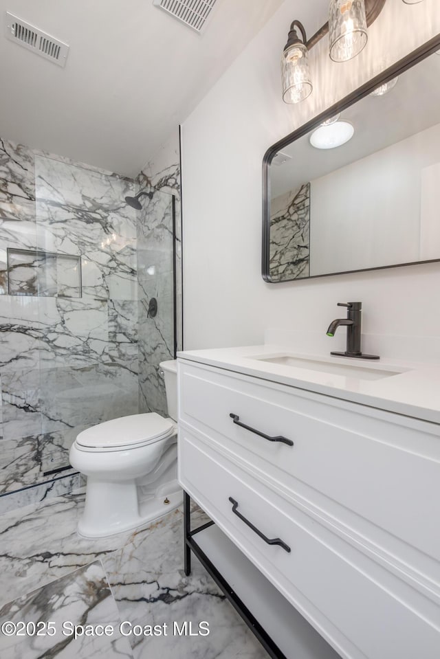 bathroom with visible vents, marble finish floor, toilet, and vanity