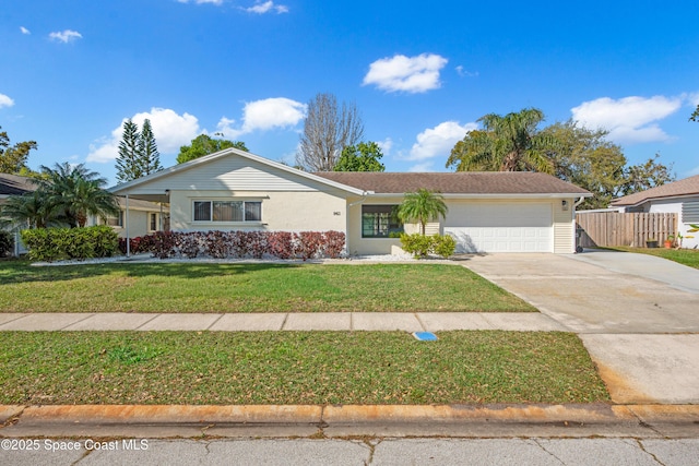 ranch-style house with stucco siding, fence, concrete driveway, a front yard, and an attached garage