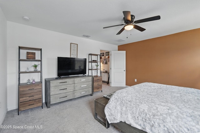 bedroom with visible vents, ceiling fan, and carpet