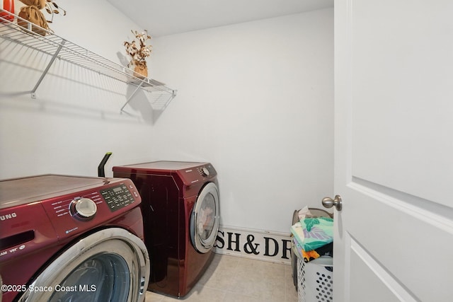 laundry area with tile patterned floors, laundry area, and independent washer and dryer