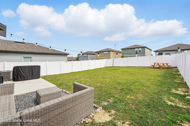 view of yard featuring central air condition unit, a patio, and a fenced backyard