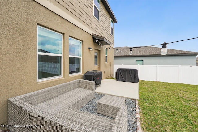 view of patio with fence and a grill