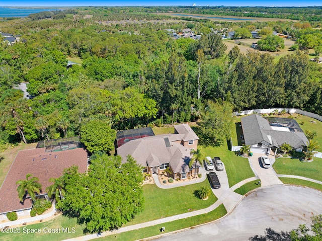 aerial view featuring a wooded view