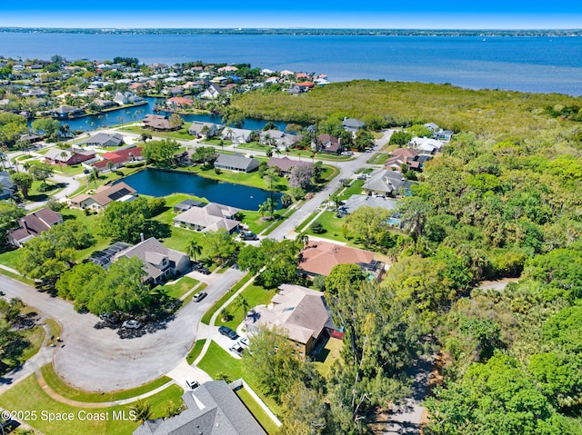 aerial view with a residential view and a water view