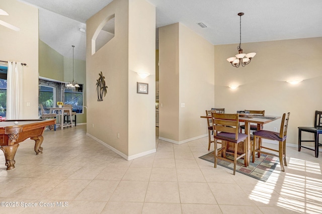 dining area featuring light tile patterned floors, baseboards, visible vents, high vaulted ceiling, and an inviting chandelier