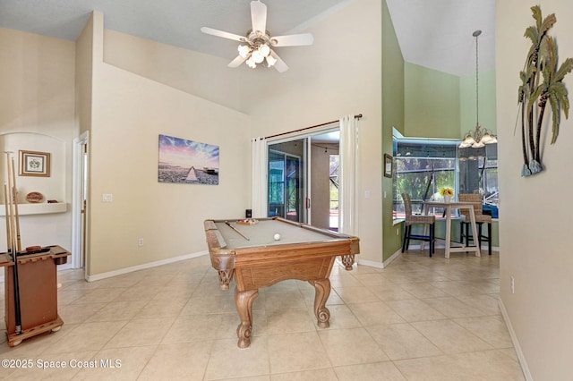 game room featuring light tile patterned floors, a high ceiling, and baseboards