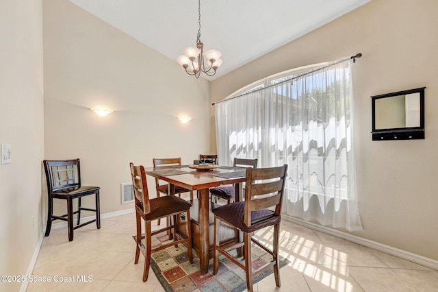 dining space with light tile patterned floors, visible vents, baseboards, and a chandelier