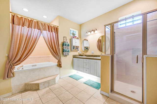 full bath with tile patterned flooring, a bath, a stall shower, and a sink