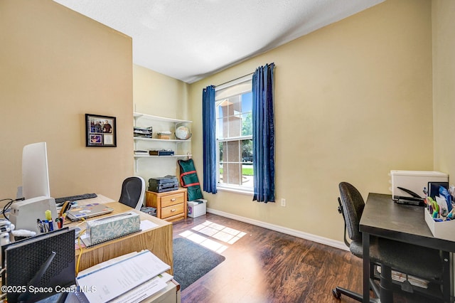 home office featuring wood finished floors and baseboards