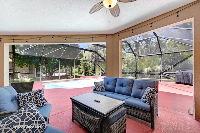 view of patio with an outdoor living space, an outdoor pool, a lanai, and a ceiling fan