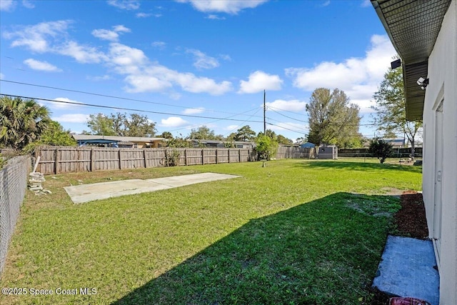 view of yard featuring a patio and a fenced backyard