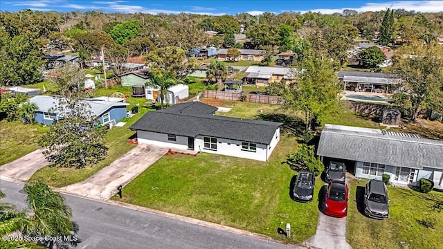 birds eye view of property with a residential view