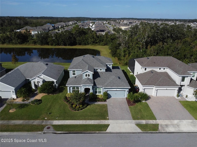 drone / aerial view with a residential view and a water view