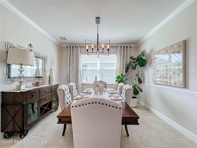 dining area with visible vents, crown molding, baseboards, a chandelier, and a textured ceiling