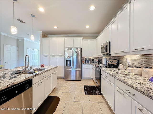 kitchen featuring a sink, tasteful backsplash, appliances with stainless steel finishes, and white cabinets