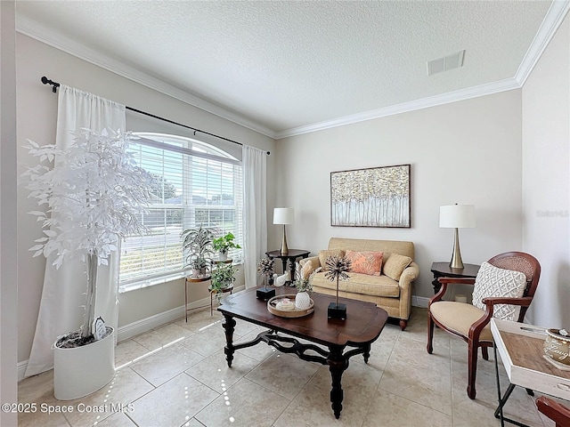 living area with visible vents, a textured ceiling, crown molding, light tile patterned floors, and baseboards