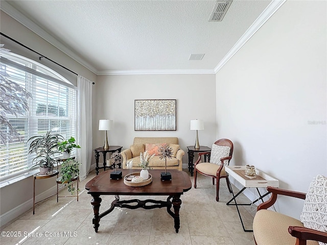 living area featuring visible vents, crown molding, baseboards, light tile patterned flooring, and a textured ceiling