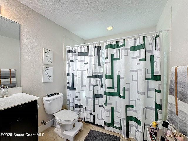 full bathroom featuring vanity, a shower with curtain, a textured ceiling, tile patterned floors, and toilet